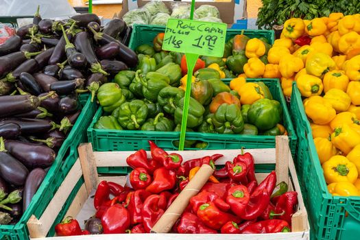 Colorful peppers and eggplant for sale at a market