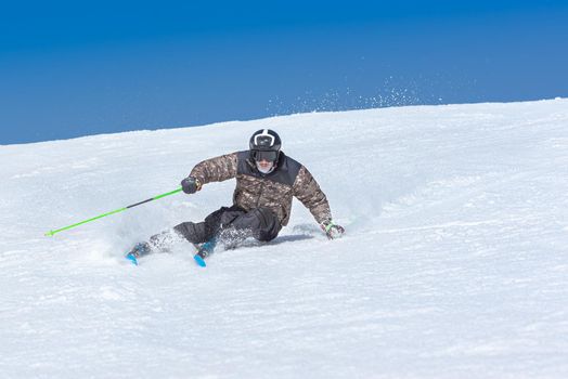 Young  man skiing on a sunny day in Andorra.