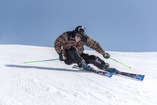 Young  man skiing on a sunny day in Andorra.