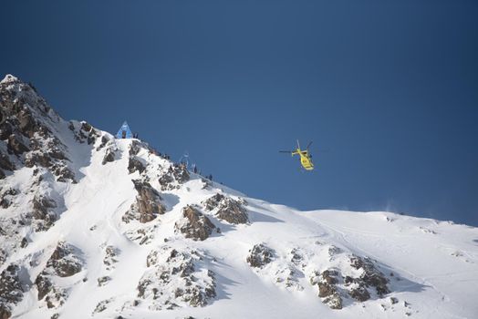 Ordino Arcalis, Andorra: 2021 February 24: Helicopter in action at the Freeride World Tour 2021 Step 2 at Ordino Alcalis in Andorra in the winter of 2021.