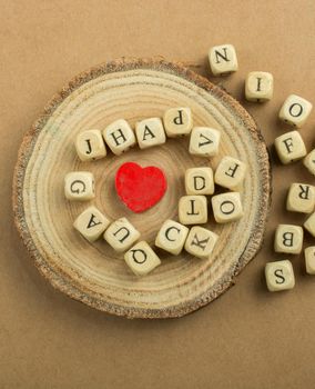 Red Love icon and Letter cubes of made of wood