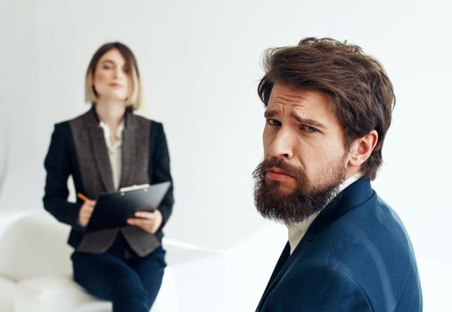 and emotional man at job interview and business woman in suit in the background. High quality photo