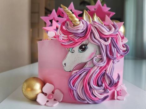 Colorful bright cake decorated in the form of a fantastic unicorn.Texture or background