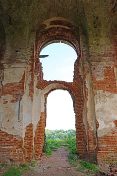 Old ruined red brick church. The consequences of the war