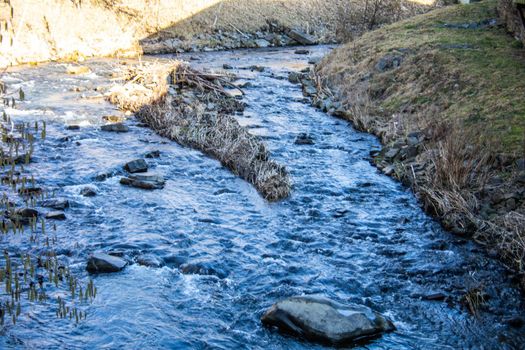 wild river in spring with spray