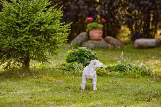 Figurine of a sheep in the garden