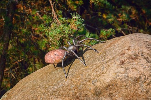 Figurine of a spider on the stone