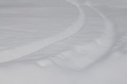 Winter landscape, car trail in fresh deep snow