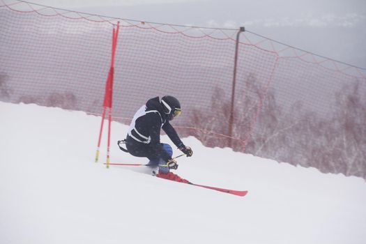 Super G race, alpine skier attack ski gate competition