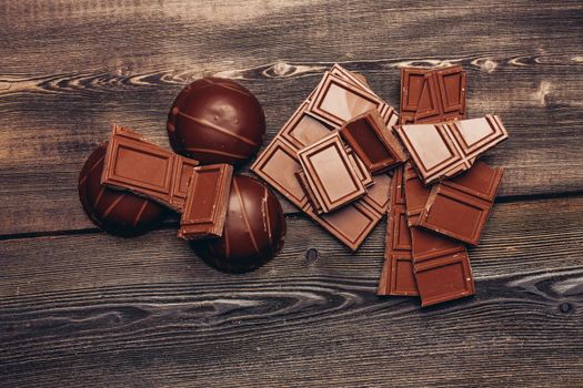 sweets chocolate cakes on a wooden table top view. High quality photo