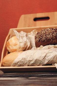 rye bread on a paper stand and a blackboard in the background. High quality photo