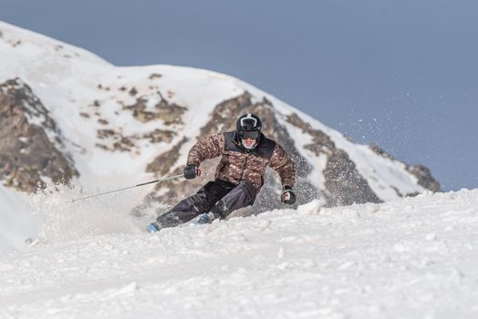 Young  man skiing on a sunny day in Andorra.