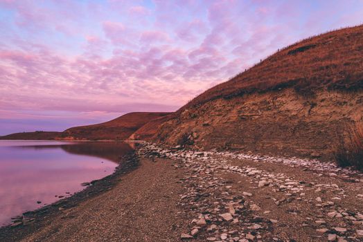 Autumn sunrise on the hilly coast of Zay river