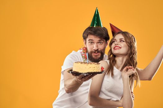 Merry time holiday cake different birthday yellow background. High quality photo