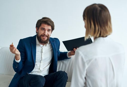 Men and women in suits of colleagues at work office communicating. High quality photo