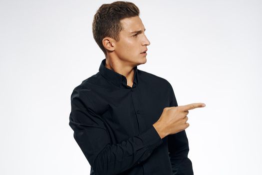 business man in black shirt studio cropped view gray background. High quality photo