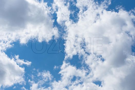 Clear clouds soaring in the sky and the inscription ozone symbolizing freedom and air