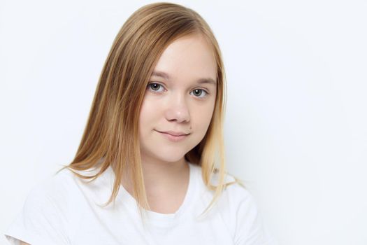 cute smiling girl in white t-shirt close up isolated background. High quality photo