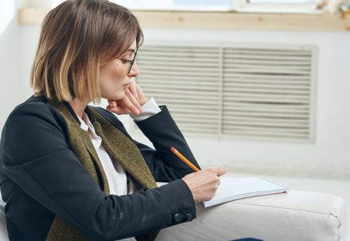 Business woman with documents and in a fashionable jacket. High quality photo