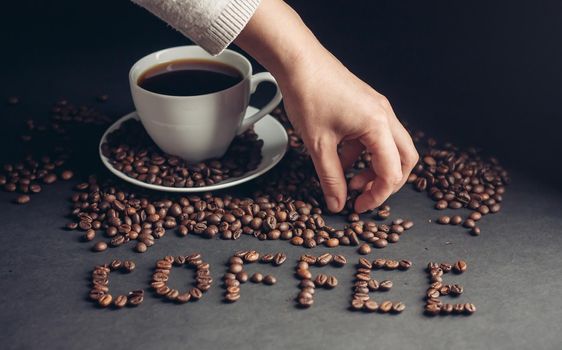 a cup of coffee for breakfast and the inscription arabica drink on the table. High quality photo