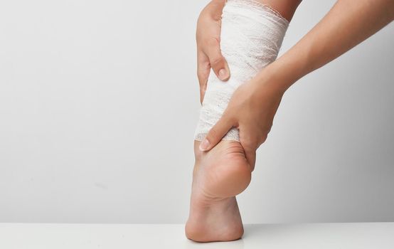 summer injury female leg bandage health problems pain. High quality photo