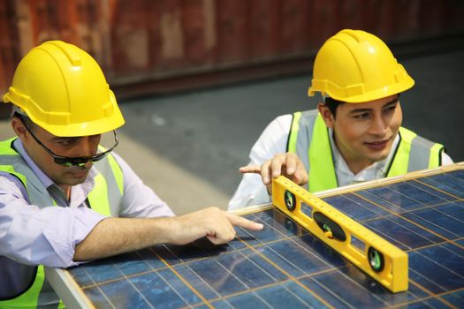 technicians install panels Solar cells to produce and distribute electricity. Energy technology concept