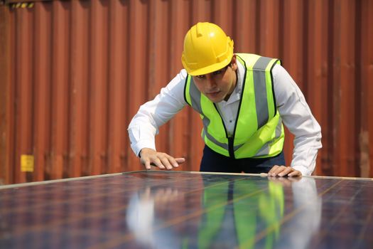 Male worker is installingsolar panel, technician installing solar panels on roof. Alternative energy sun energy power, ecological concept. 