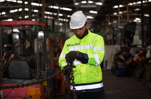 workers helmets at the factory, workers in the factory, people go in helmets and uniforms for an industrial enterprise