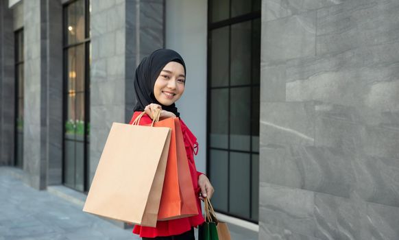 Shopping woman holding shopping bags 