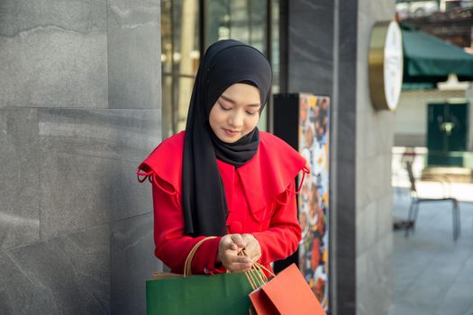 Shopping woman holding shopping bags 