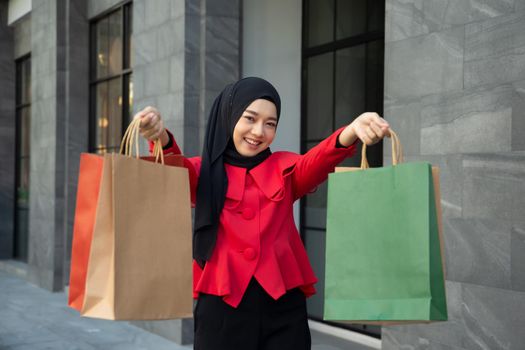 Shopping woman holding shopping bags 