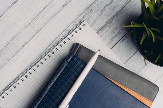 notepads documents desktop office close-up pen objects from above. High quality photo