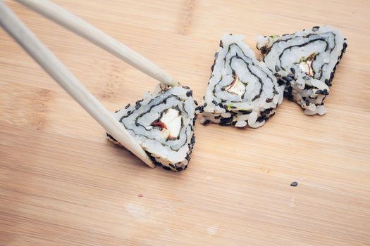 sushi chopsticks restaurant wood cutting board. High quality photo