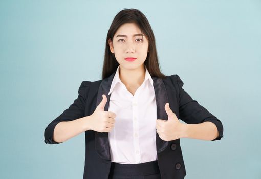 Asian business women in suit and thump up hand sign