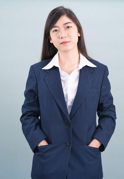 Portrait of asian businesswoman isolated on gray background