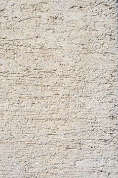 Detail of a white painted rough wall