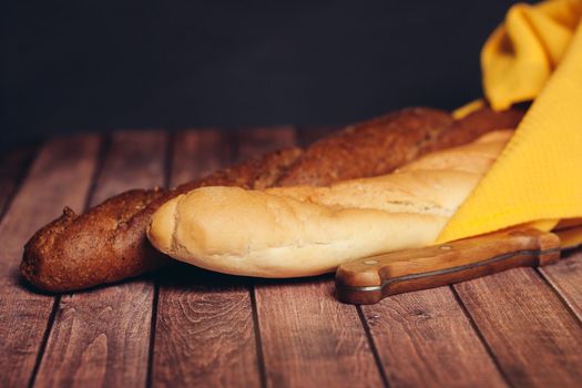 slicing loaf on a cutting board wooden table kitchen food flour product. High quality photo