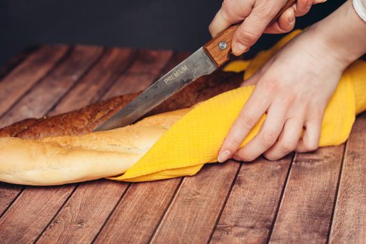 slicing a loaf on a cutting board kitchen eating breakfast fresh smell. High quality photo
