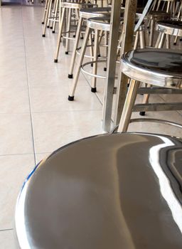 Shiny Stainless steel stool in the canteen of school