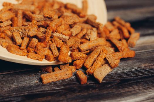 salty croutons snacks delicacy meal wooden table. High quality photo