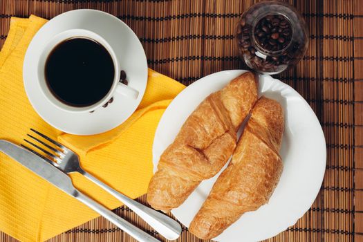 fresh croissants on the table coffee cup breakfast . High quality photo