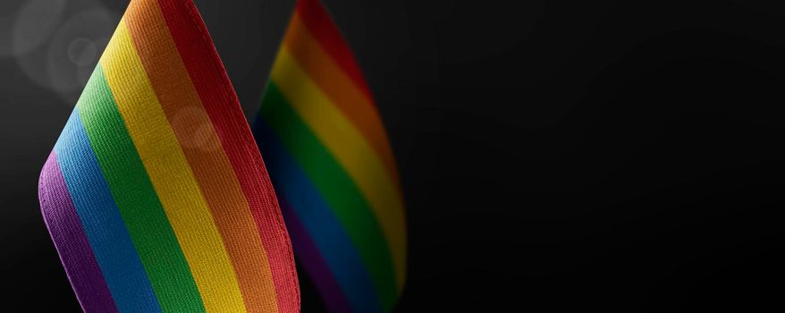 Small national flags of the lgbt on a dark background.