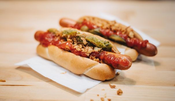 sandwich on a wooden table and boiled sausages pan cooking hot dog. High quality photo