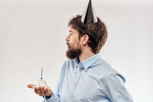 Happy guy with birthday cake white background Compact corporate party cropped beard view. High quality photo