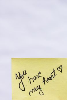 You have my heart handwriting text close up isolated on yellow paper with copy space.