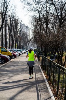 Jogging, running in the city park. Healthy lifestyle, outdoor physical activity and fitness concept in Bucharest, Romania, 2021