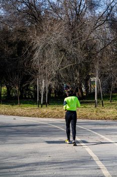 Jogging, running in the city park. Healthy lifestyle, outdoor physical activity and fitness concept in Bucharest, Romania, 2021