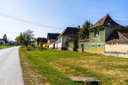 Typical rural landscape and rustic houses in Barcut -Bekokten, Transylvania, Romania, 2021.