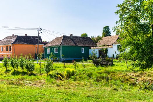 Typical rural landscape and rustic houses in Barcut -Bekokten, Transylvania, Romania, 2021.