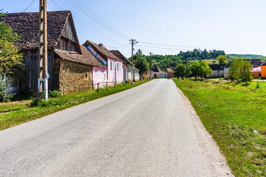 Typical rural landscape and rustic houses in Barcut -Bekokten, Transylvania, Romania, 2021.